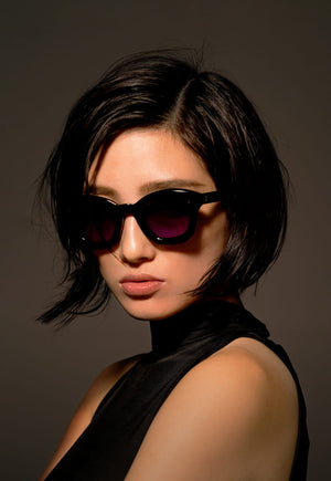 A woman wearing Sauvage glasses