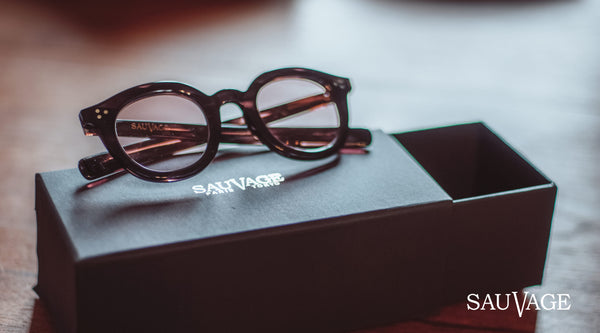 Brand Sauvage glasses placed on its box